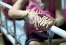 Epilepsy Pill Revives Worn-Out Joints? Elderly person’s hands resting on a hospital bed rail