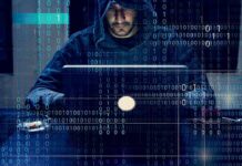 FBI Blitz Cracks Mega Scam Hubs Person in hoodie using a laptop with binary code overlay