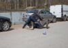 France ERUPTS: 550,000 Hit The Streets Men scuffle on a street beside parked cars