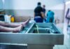 Grim Autopsy Shreds Hit-And-Run Tale cadaver on stainless autopsy table in clinical room