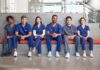 Group of medical professionals sitting on a bench