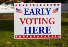 Naked Arrest Sparks DHS – Campaign Standoff Early voting sign on a lawn