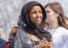 Immigration Probe Zeroes In On Rep. Ilhan Omar Ilhan Omar wearing a black headscarf at an outdoor event