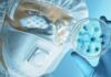 Mystery Pneumonia Rocks Russian Plague Lab Scientist in protective gear examining a petri dish