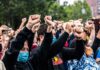 Orléans Locked Down – Protesters Surge Crowd of protesters with raised fists wearing masks