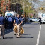 Hate Crime Fears Grip Fifth Avenue Police officers and investigators at a blocked city street scene
