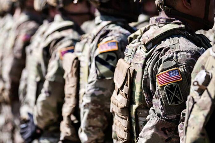 shutterstock_2321207565 Soldiers in camouflage uniforms standing in formation