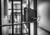 Jail cell door with key in the lock