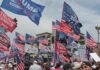 Trump Rally Sparks $4B Audi Bet Crowd at political rally with many American and campaign flags