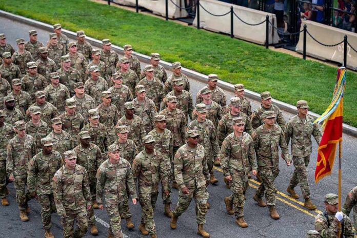 Soldiers in camouflage uniforms march in formation on a street