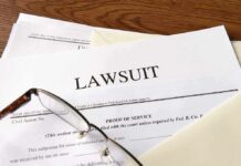 ‘Blackmailer’ Label Risks BACKFIRE Legal documents labeled lawsuit on a desk