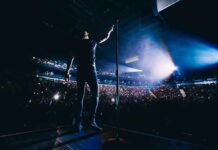Country Star BLASTS Columbus – Backlash Explodes Singer on stage facing a large concert crowd