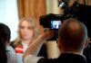 Trump Halts Livestream, Firing Squad Stays tv camera films interview with blurred speaker